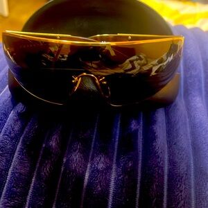 A pair Prada Glasses